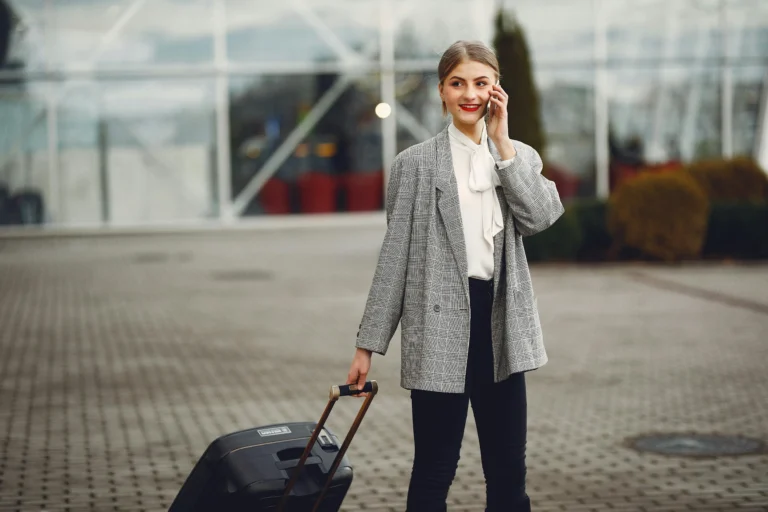 women with a suitcase booking a minibus for corporate travel